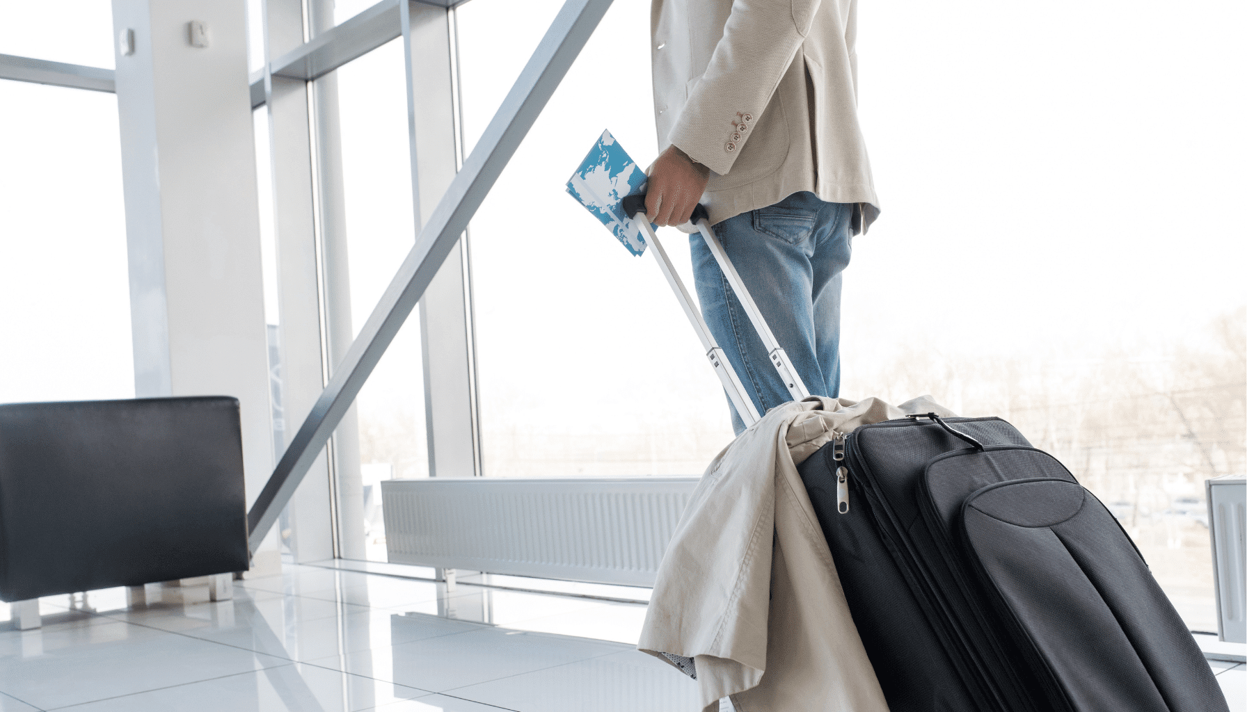 a man with suitcase in airport