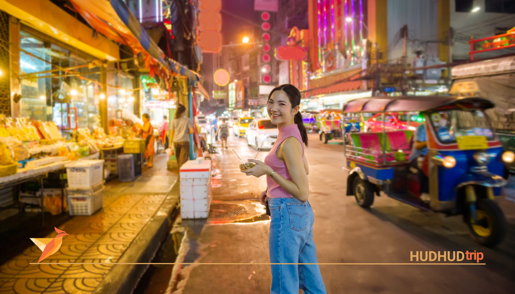 a woman stay in the street and enjoying of street food