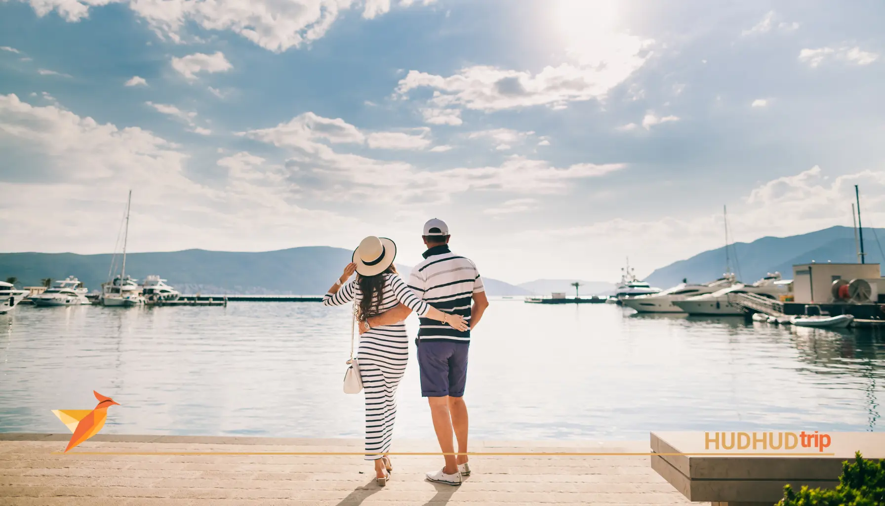 A couple stand in front of sea