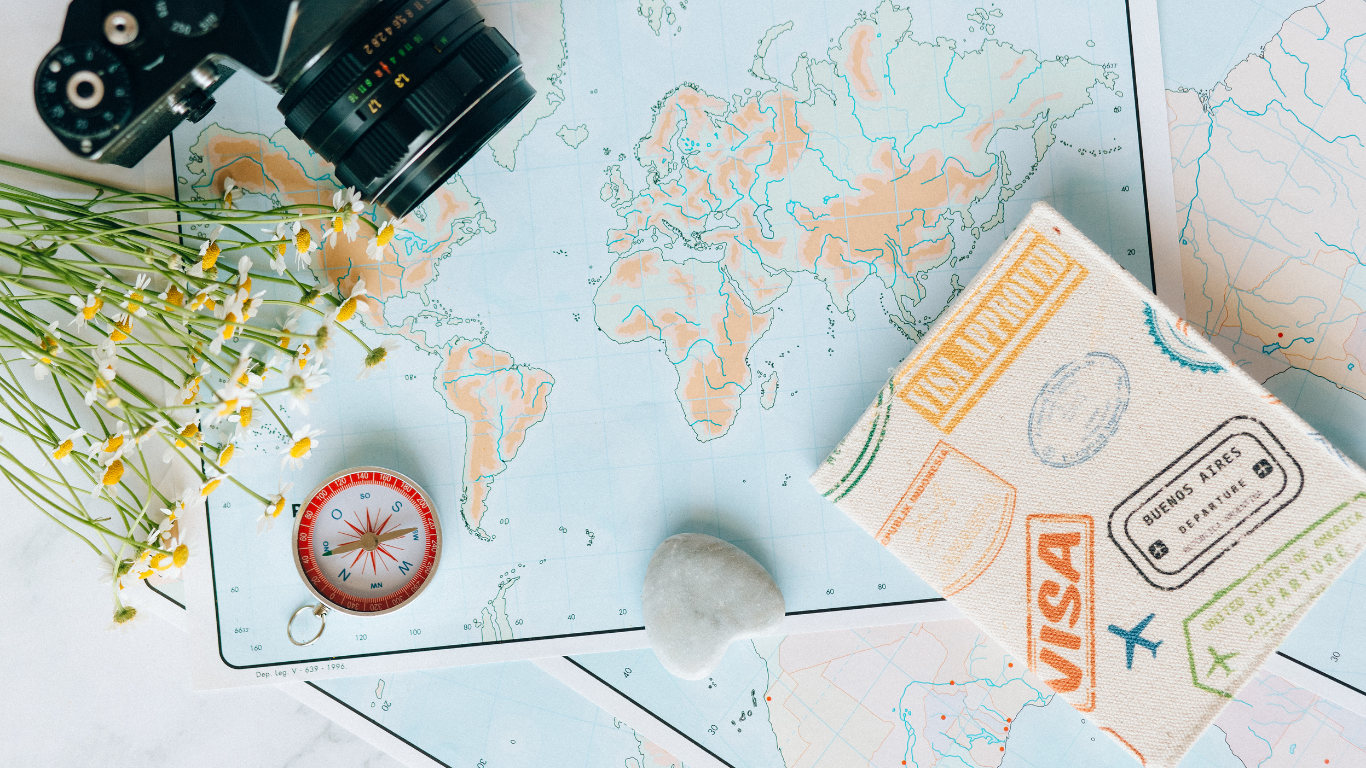 visa with map and camera on the desk