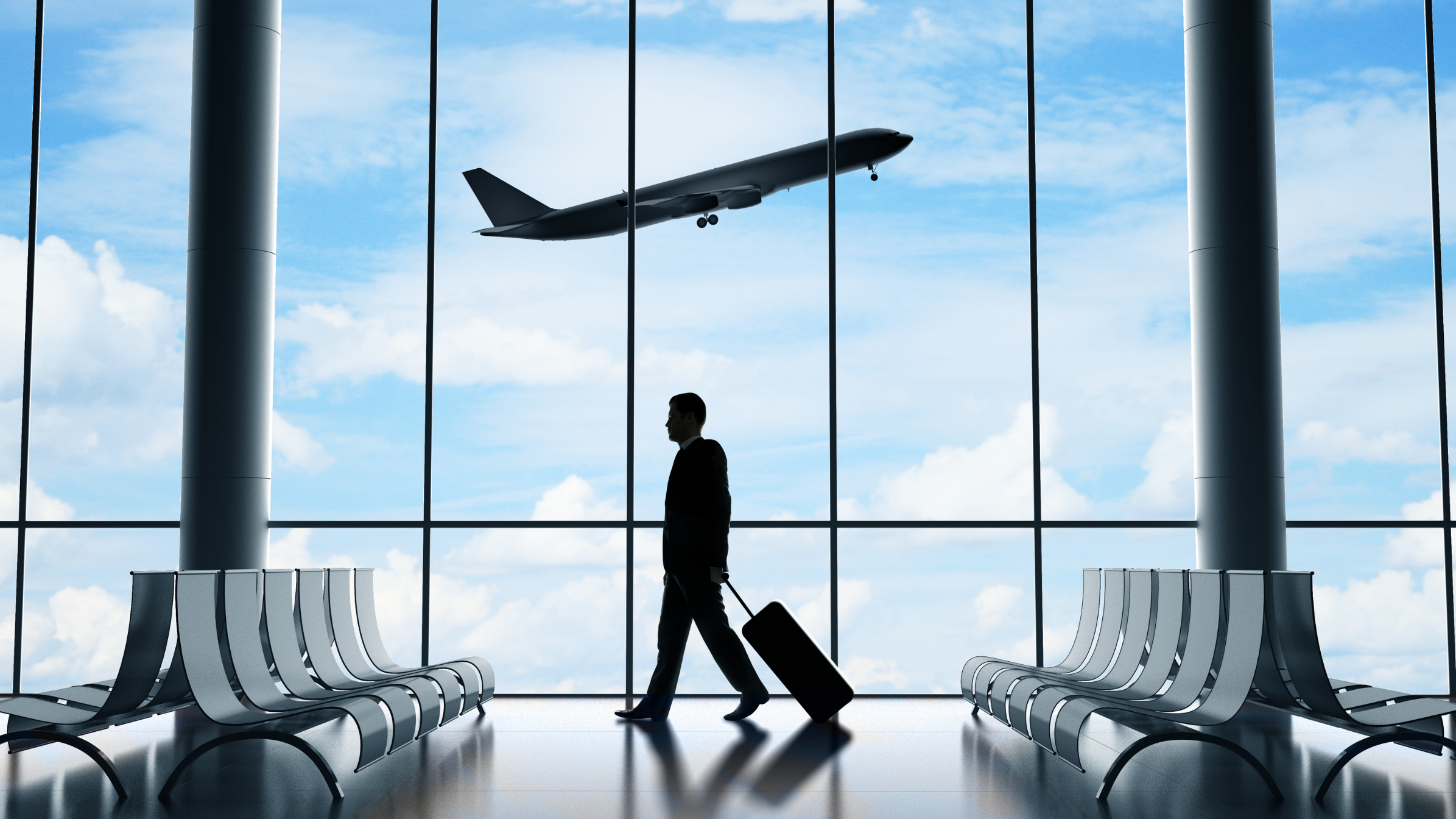 a man with suitcase stand in airport